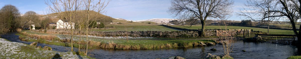 A panoramic photograph of Malham Cove in North Yorkshire.